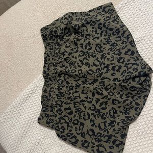 Green cheetah print athletic shorts